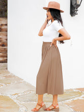 The Reed Pleated Midi in Black